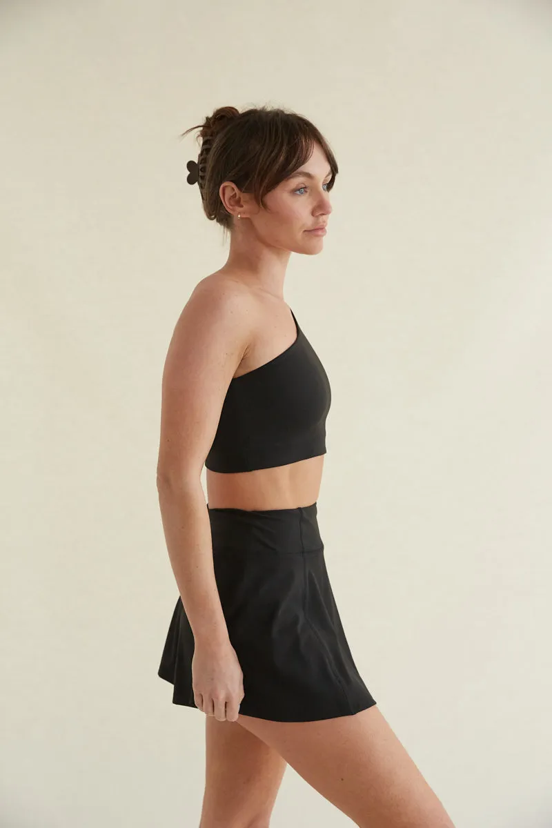 Avery Smoothing Flare Tennis Skort in Black