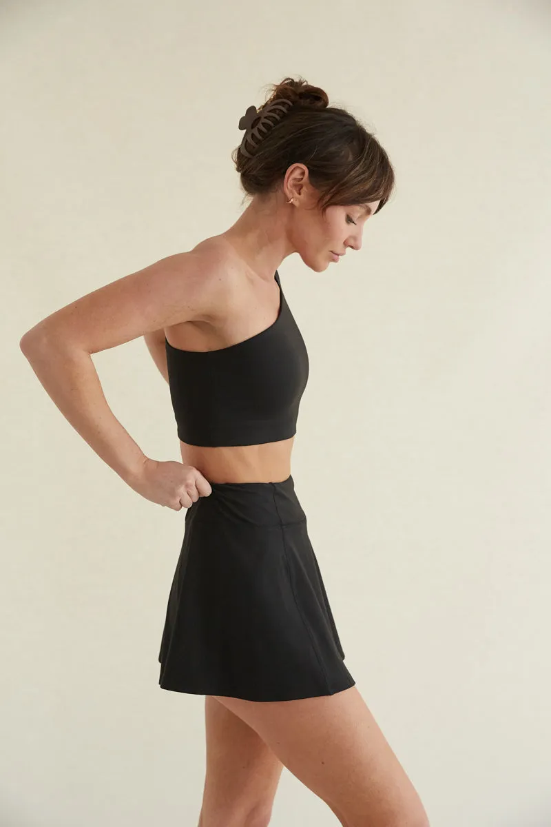 Avery Smoothing Flare Tennis Skort in Black